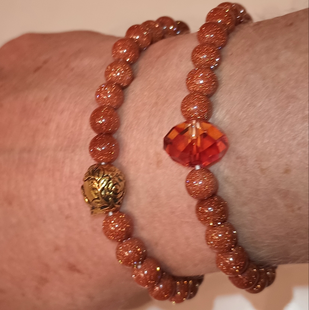 Stretchy bead and crystal and metal bracelets, as a set.